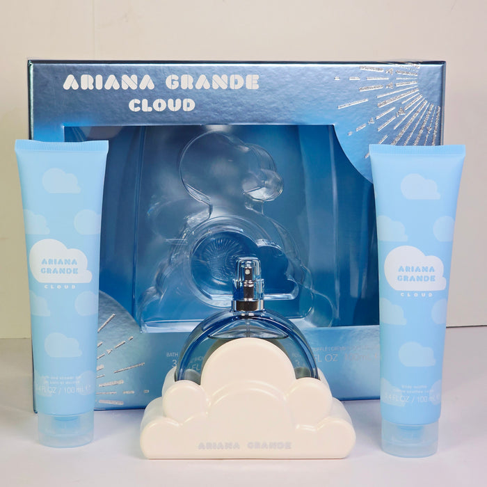 Ariana Grande Cloud perfume set with bottle, box, and cloud-shaped items on a light gray background