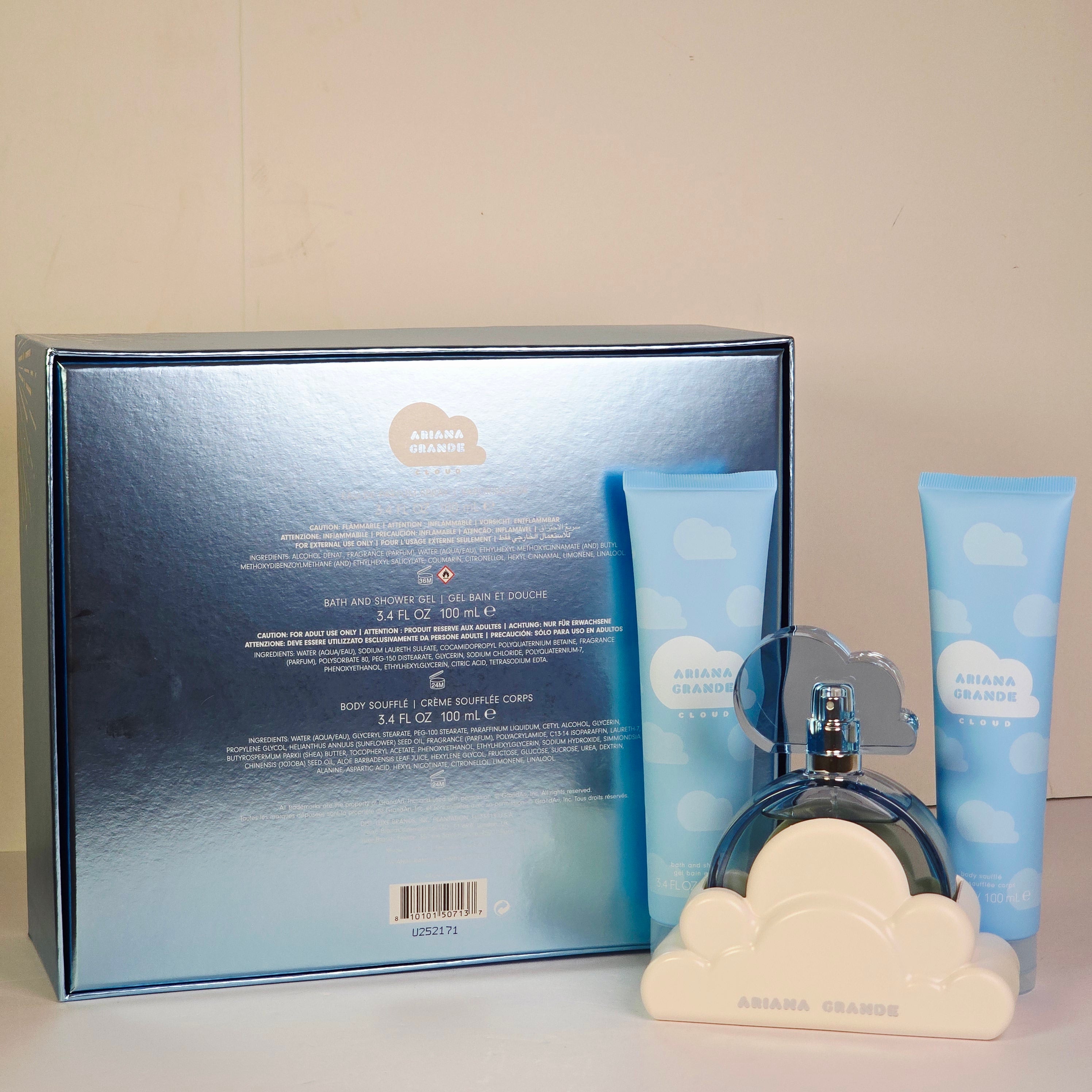 Ariana Grande Cloud perfume set with bottle, box, and cloud-shaped items on a light gray background