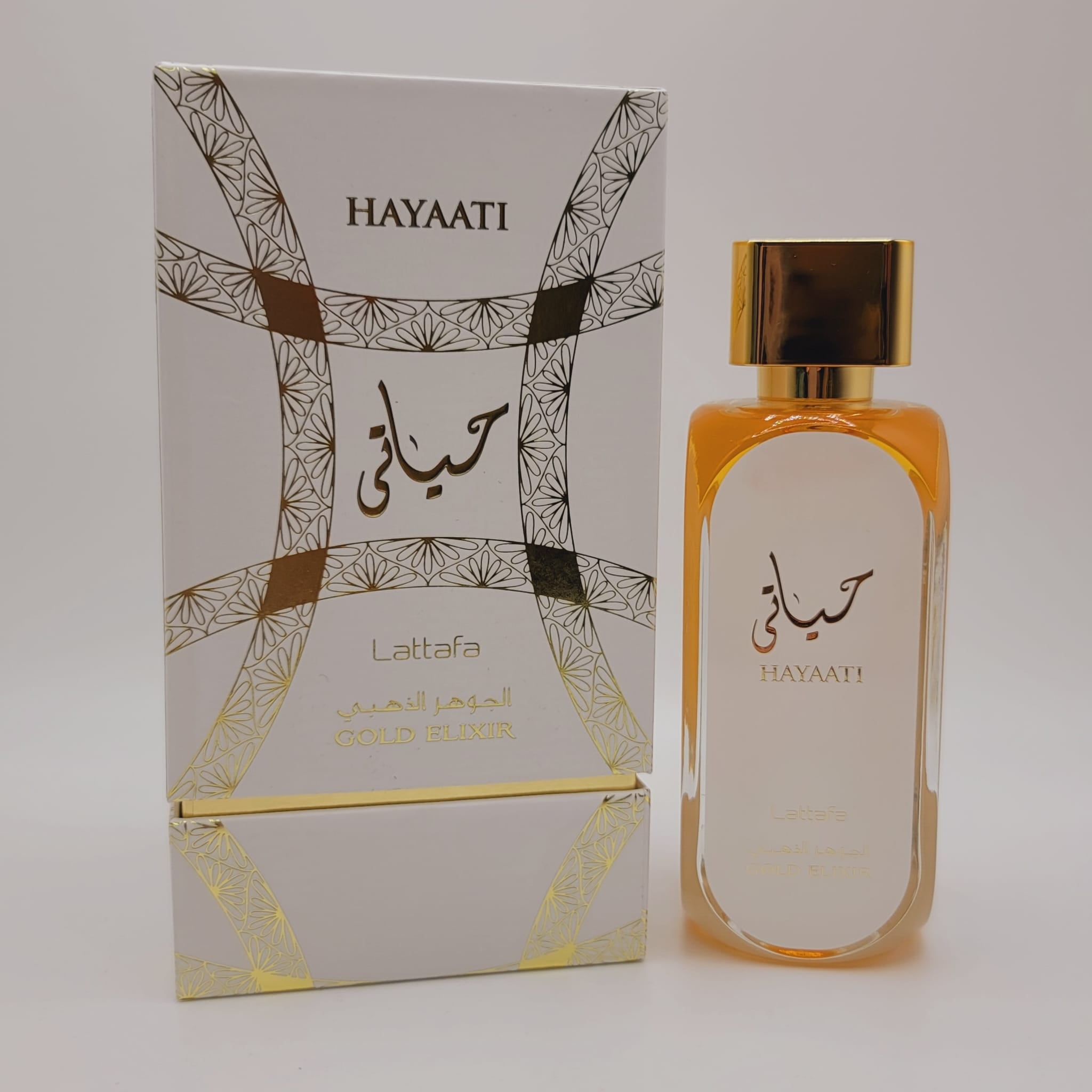 Hayaati Gold Elixir de Lattafa, espray de 100 ml/3.4 fl oz Eau De Parfum Unisex, fragancia floral para una elegancia atemporal.