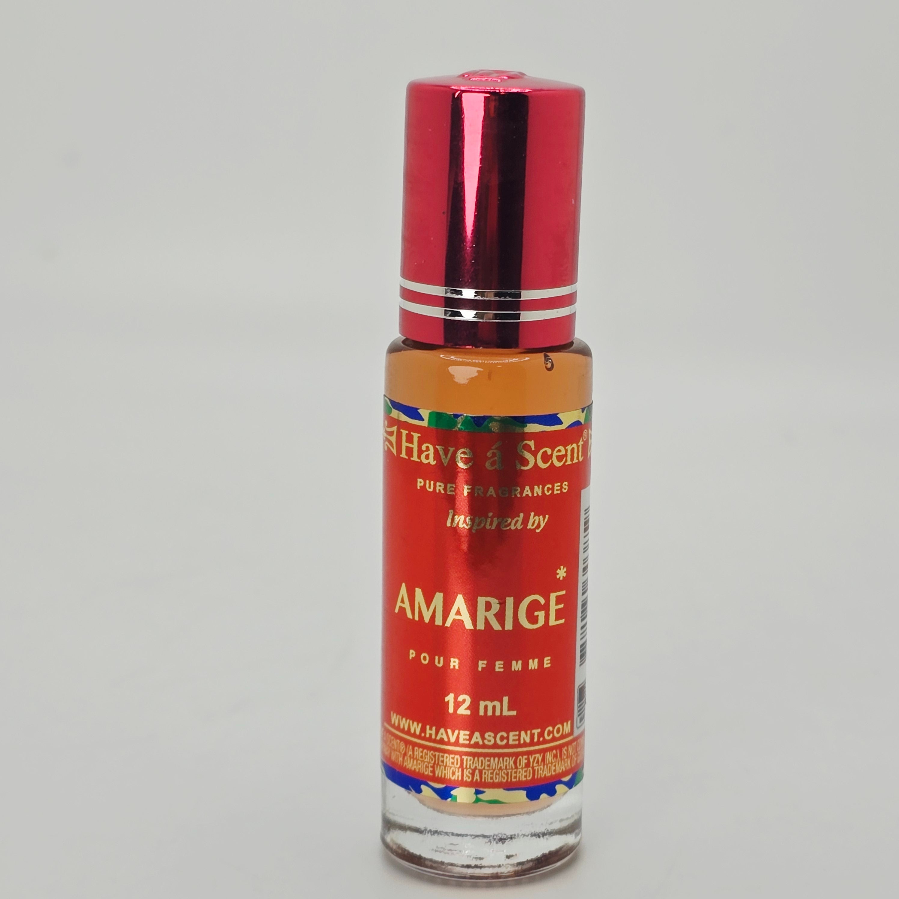 An array of Scent Roll On Body Oil bottles in various colors with labelled fragrances.