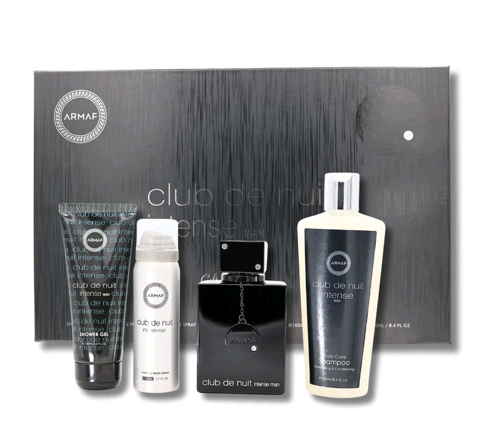 A set of Armaf Club De Nuit Intense men's grooming products, including an eau de toilette, body spray, shower gel, and shampoo, displayed in front of a black box with the product names and scents visible.